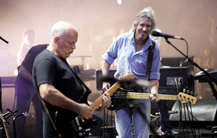 David Gilmour and Roger Waters of Pink Floyd perform on stage at 